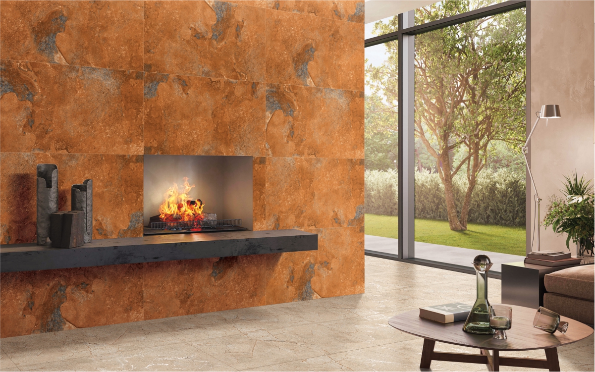 Living room wall featuring Rustica Natural Stone Cotto tiles around a fireplace, adding earthy texture and warmth to the space with a rustic, natural stone look.
