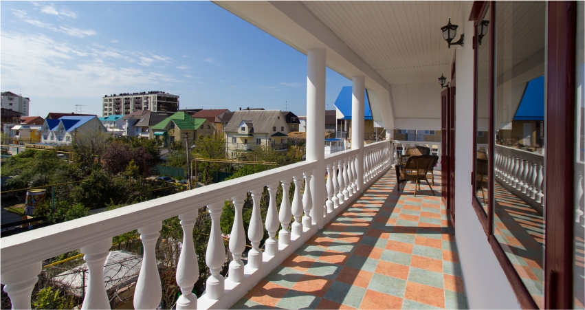 A balcony with cement grill