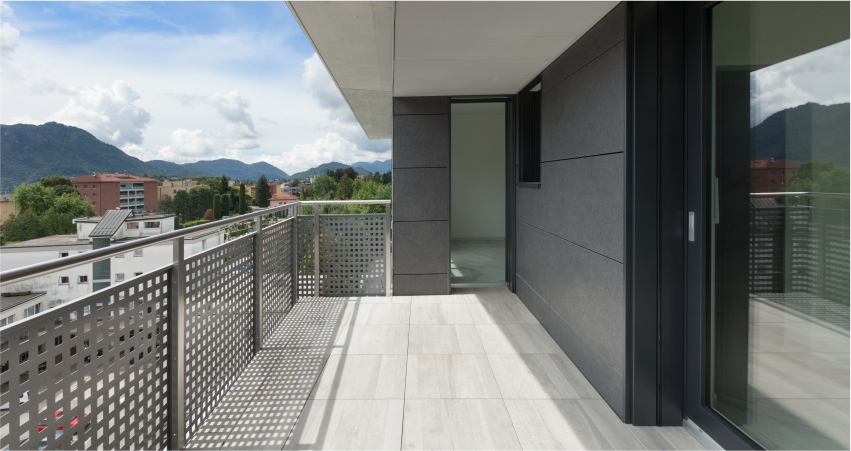 A balcony with a aluminium grills