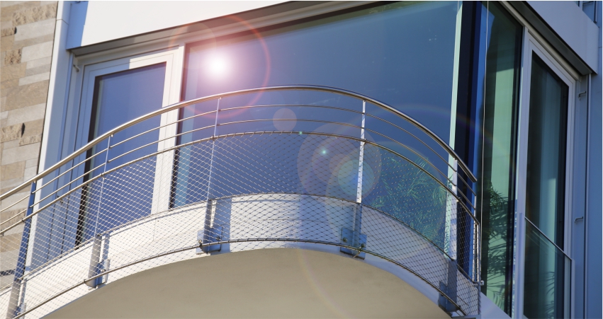 An image of a balcony with a railing.