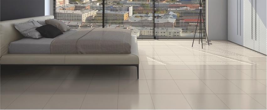 Bedroom with white wardrobe and Beige floor tiles