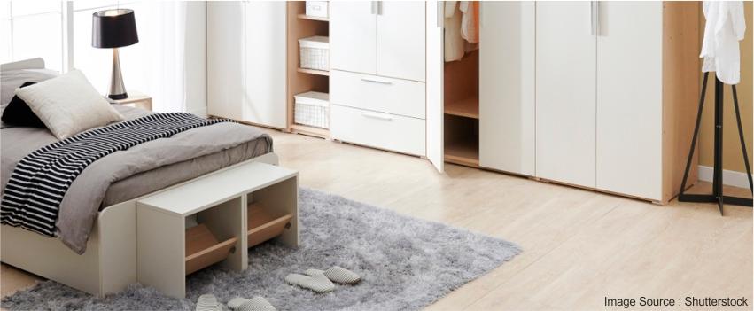 Standalone Wardrobe in bedroom with wood finish flooring 