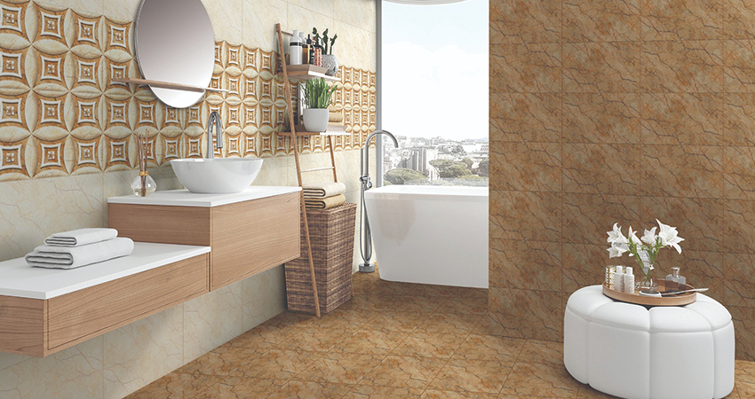 A bathroom with beige and brown tiled walls.