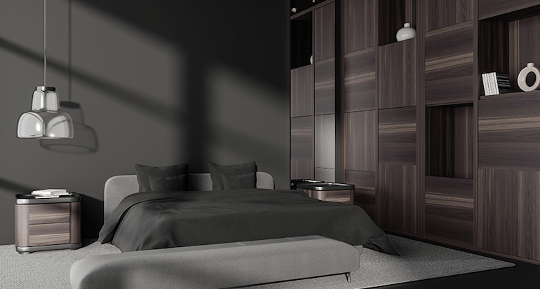 A modern bedroom with black walls, wooden furniture and a smart corner cupboard