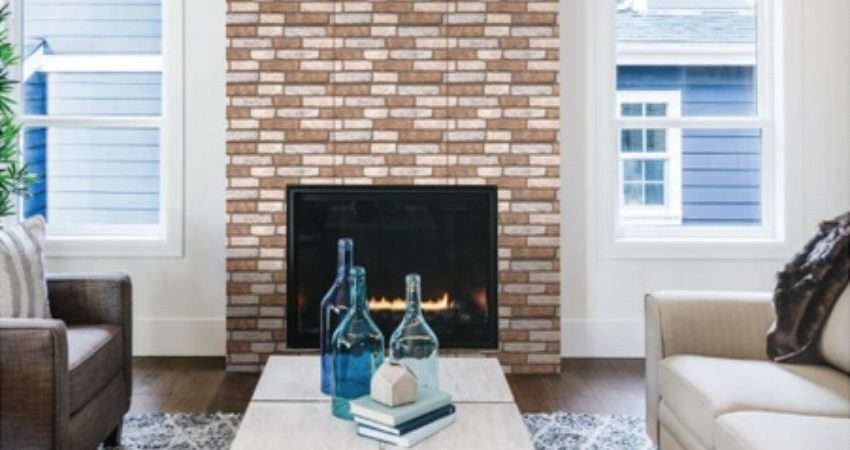 A living room with a brick fireplace.