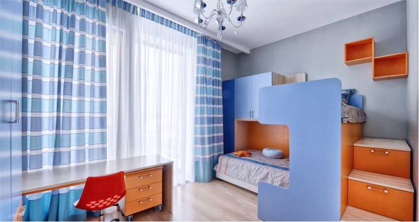 use furniture to divide the space in the kids bedroom