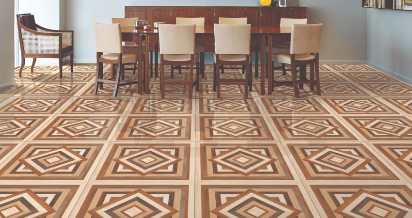 A dining room with a brown and beige tile floor.