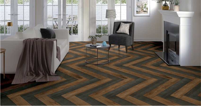 A living room with brown and black chevron flooring.