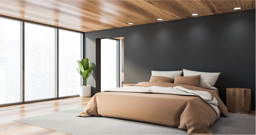 A modern bedroom with wonderful wooden panel wall and wooden floors.