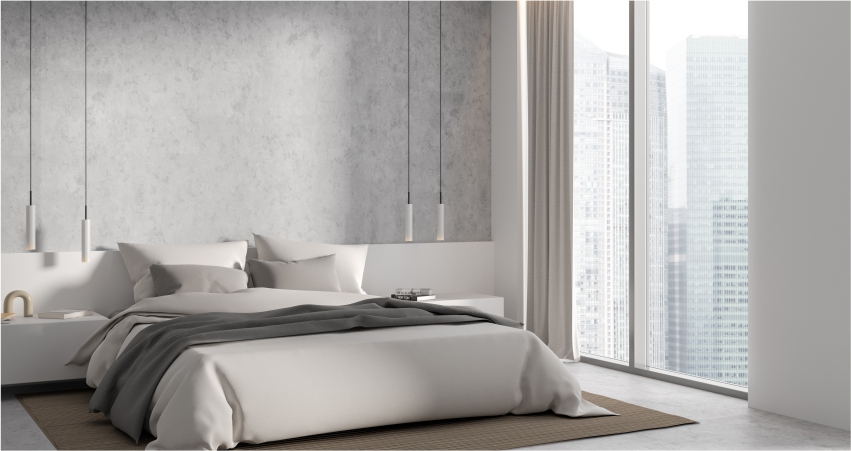 A modern bedroom with a white bed, creative concrete on walls and a view of the city.