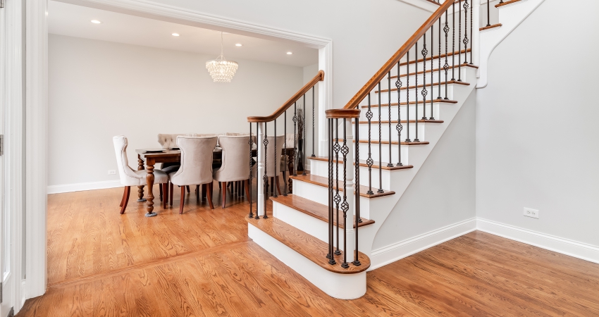 A staircase leading to a dining room in a home.