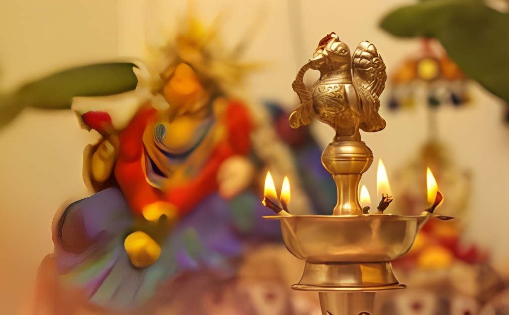 A candle is lit in front of a statue of lord ganesha.