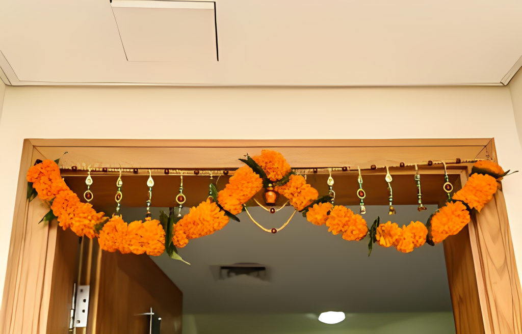 A doorway decorated with orange flowers.