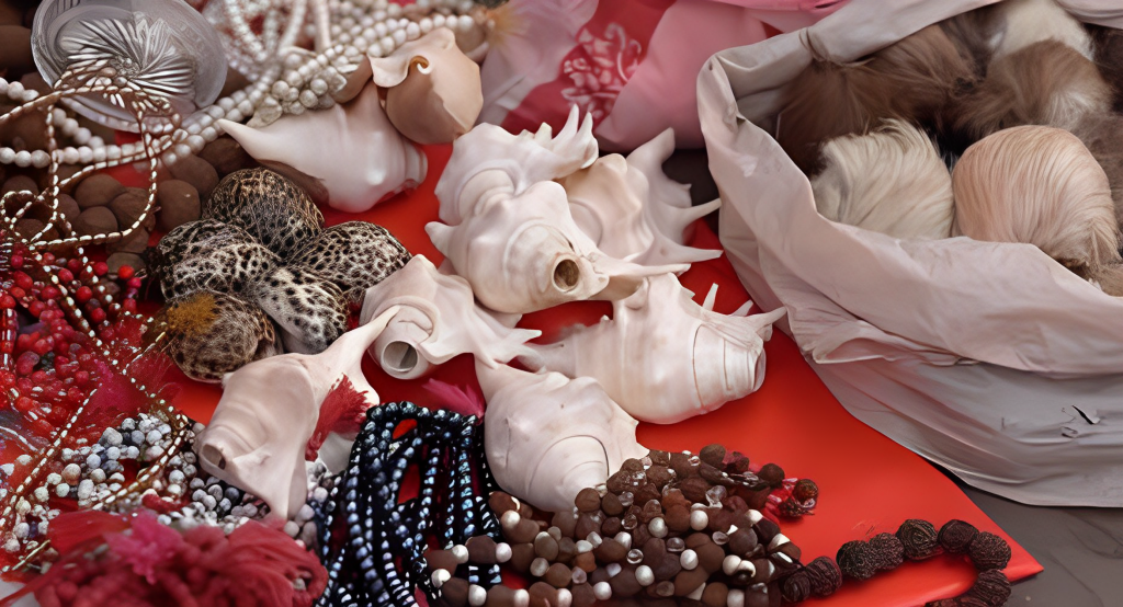 A pile of beads and shells on a table.
