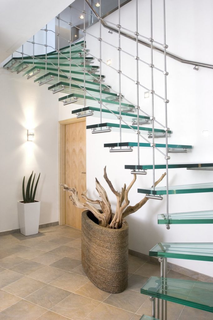 A glass staircase in a modern home.