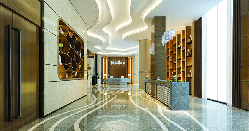 The lobby has a marble floor and false ceiling design.