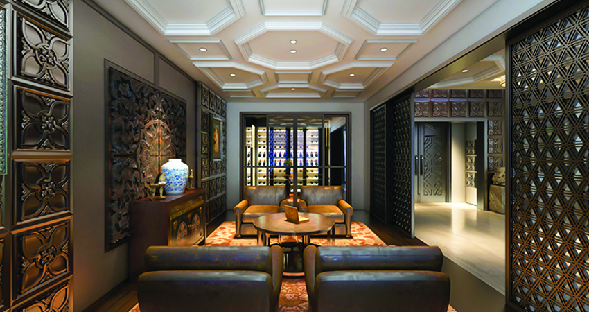 A living room with ceilings, a table and chairs.
