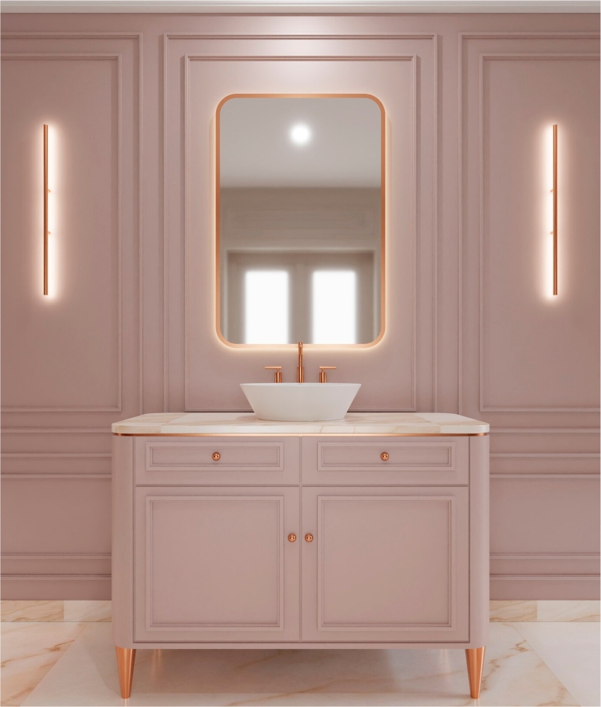 A bathroom with a pink vanity and a mirror.