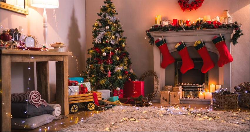 A living room with christmas decorations and stockings.