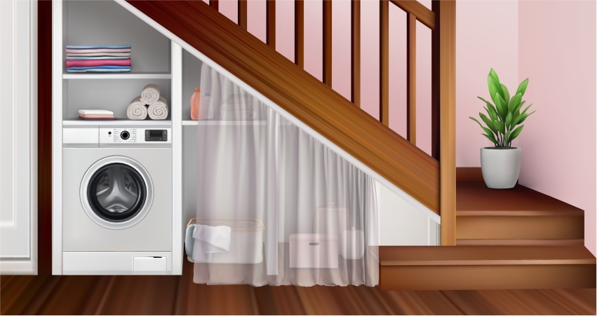 A laundry room with a washing machine under the stairs.