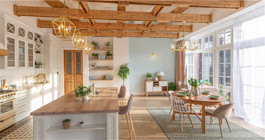 A kitchen with wooden beams and wooden floors.