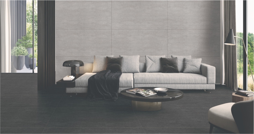 A living room with grey walls and black furniture.