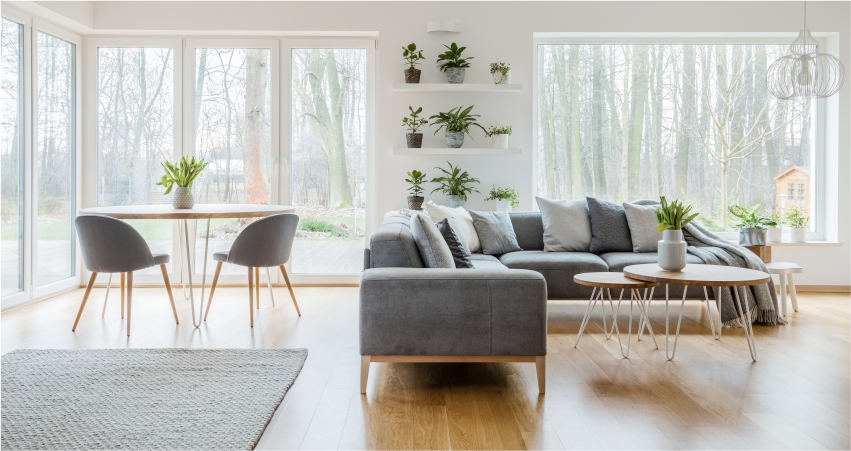 A living room with a gray couch and table.