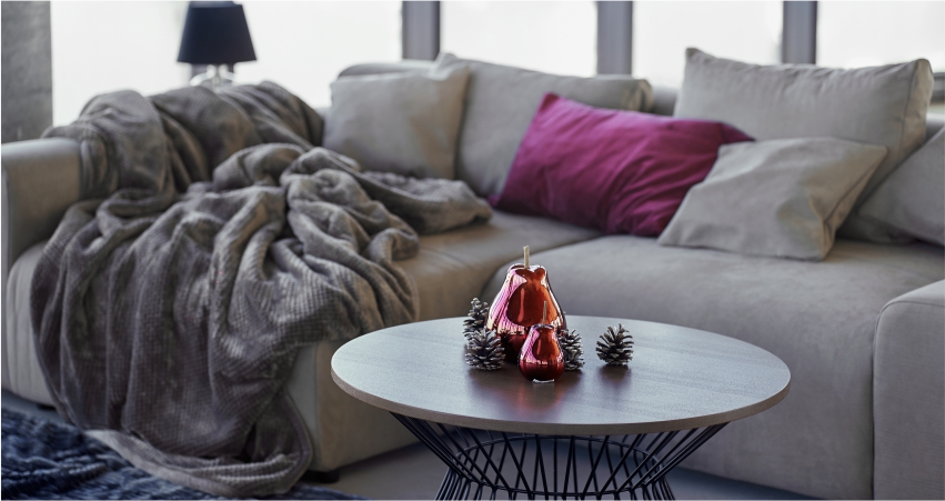 A living room with a couch and a coffee table.