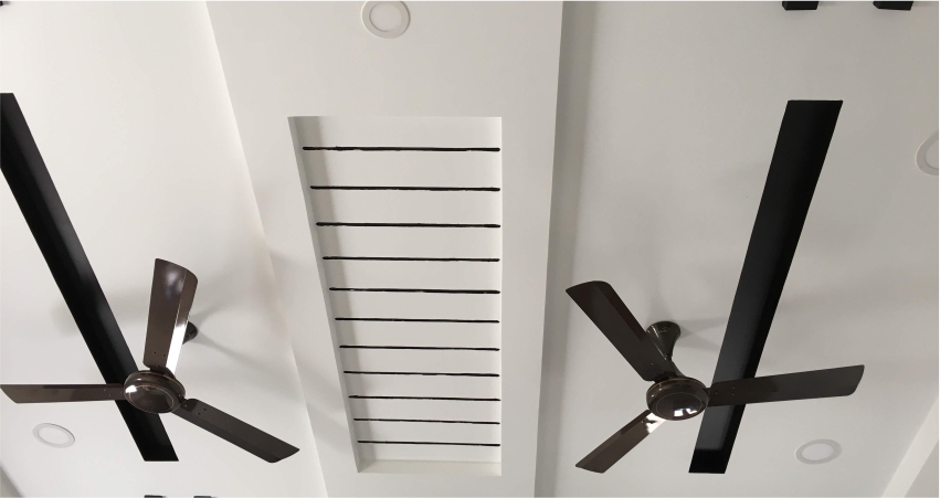 A ceiling fan with two blades on it.