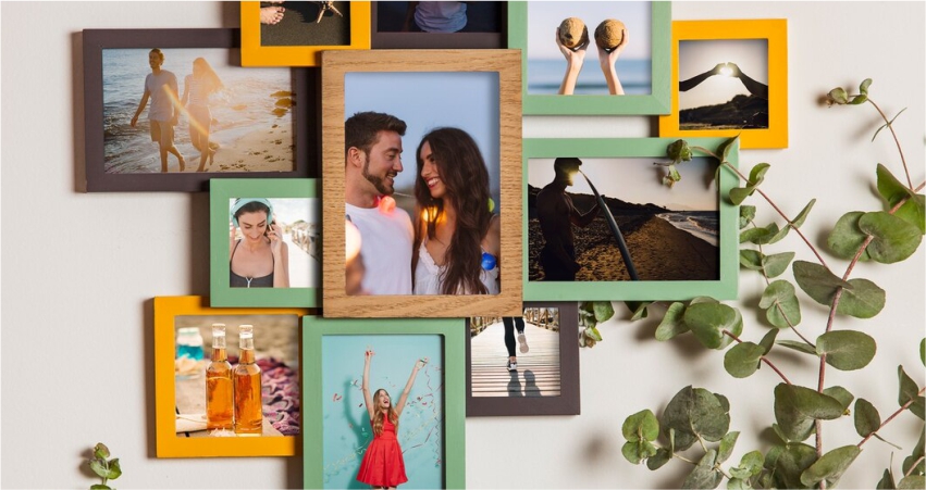 A group of photo frames hanging on a wall.