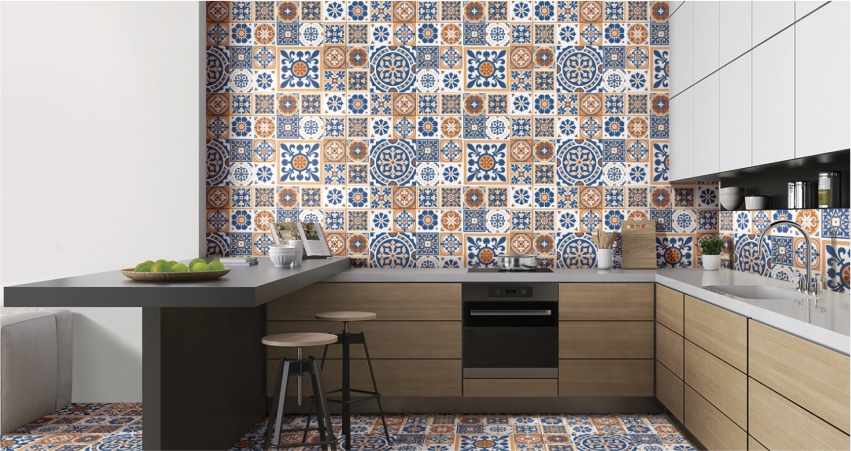 A kitchen with a blue and orange tiled wall.