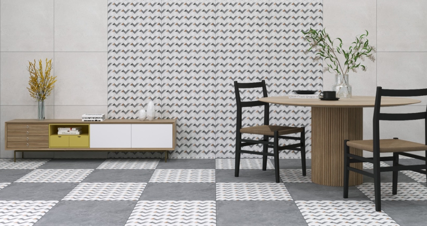 A white & grey patterned tiled floor & wall with a table and chairs.