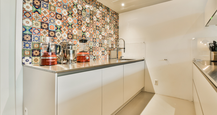 A tiled wall in a kitchen.