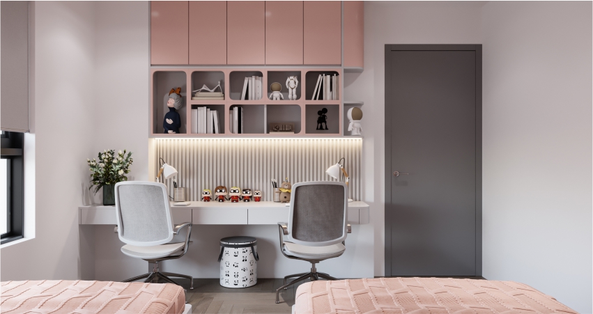 A pink and white bedroom with a study table and bookshelf.