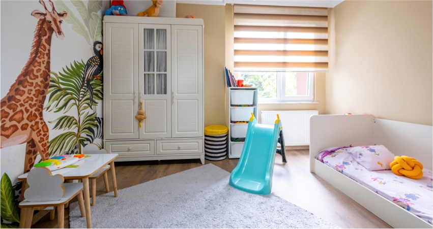 Bright and colorful children's bedroom with playful animal decorations, a small slide, and a cozy bed.