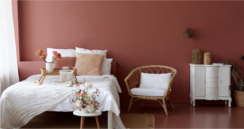 Cozy bedroom with earthy tones and soft textiles for a relaxing summer vibe