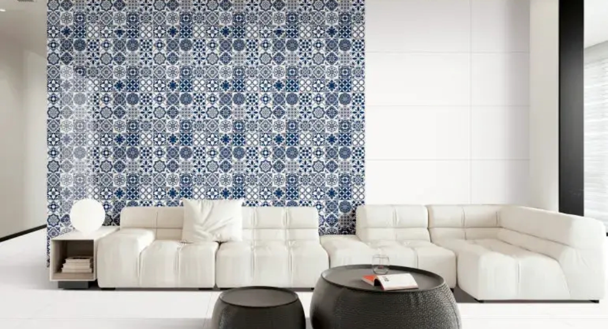 Living room interior with glossy blue wall tiles, white sofa, and matching white floor tiles for a sleek modern look 