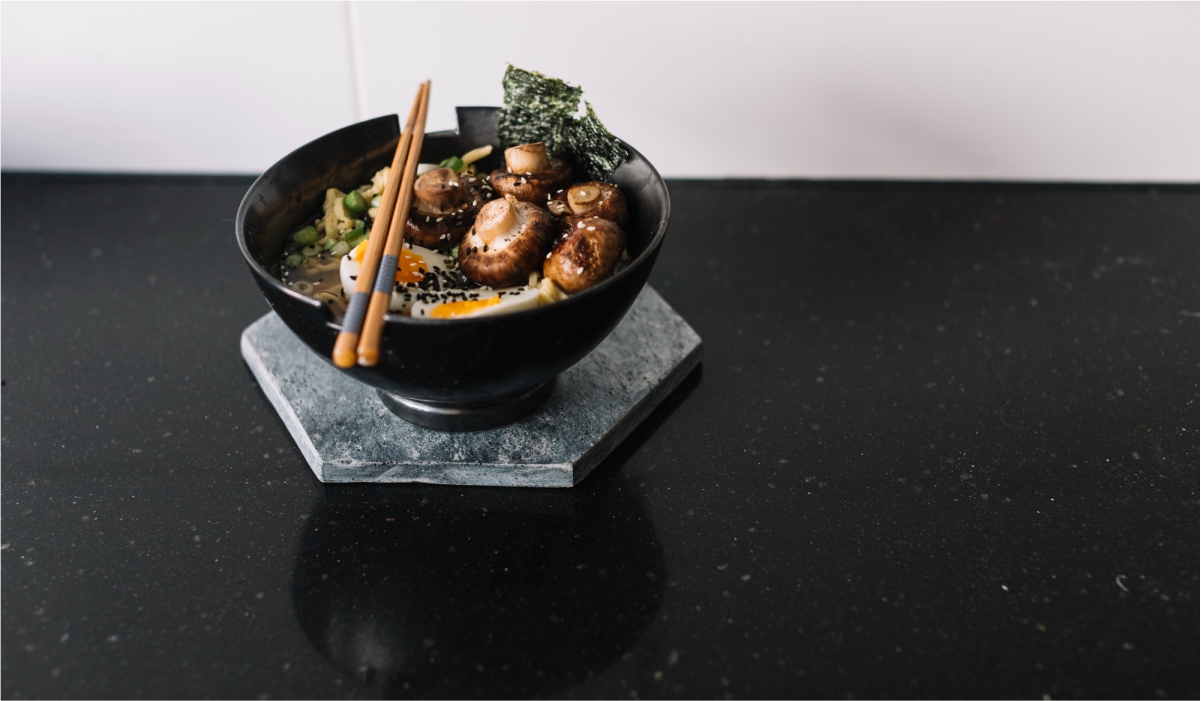 Black Galaxy Granite tile with shimmering golden specks, ideal for stylish and durable kitchen countertops.