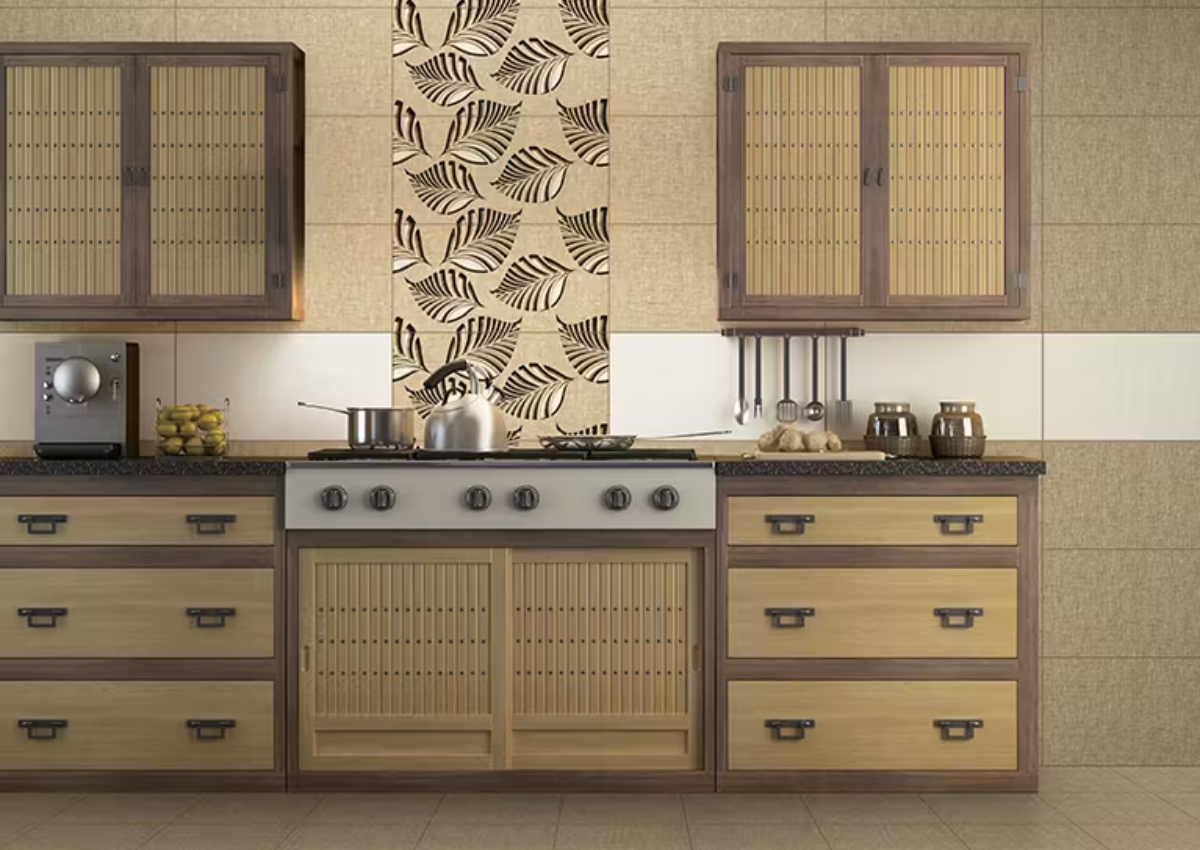 The industrial chic aesthetic has percolated to the kitchen, too. Wooden touches and brass fittings add to the rustic and charming vibe of your kitchen. The simplicity of wood can be paired with patterned tiles to bring a splash of colour. This mix of raw appeal and natural elements with intricate designs brings about a dynamic space. A rattan or slats cupboard also adds warmth to the industrial chic vibe. The kitchen tiles can range from natural elements to simple tiles with coloured patterns. Moroccan design tiles can bring about a refreshing change to the wood-dominated kitchen. This cohesive design for the heart of your home can attract attention gracefully.

10. Open Shelving with Accent Tiles
