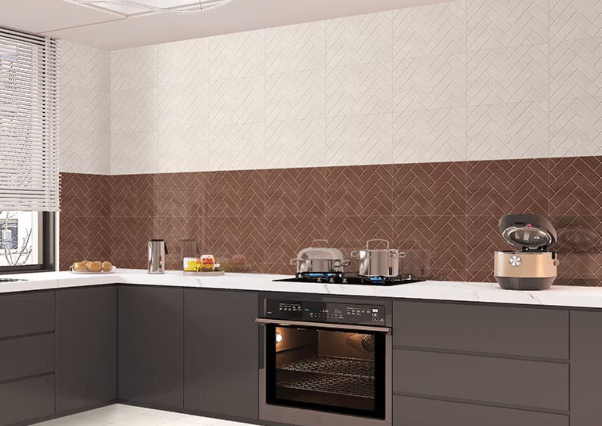 Kitchen interior featuring Cotto Herringbone ceramic glossy wall tiles, adding a warm terracotta look and stylish herringbone pattern to modern kitchen walls.
