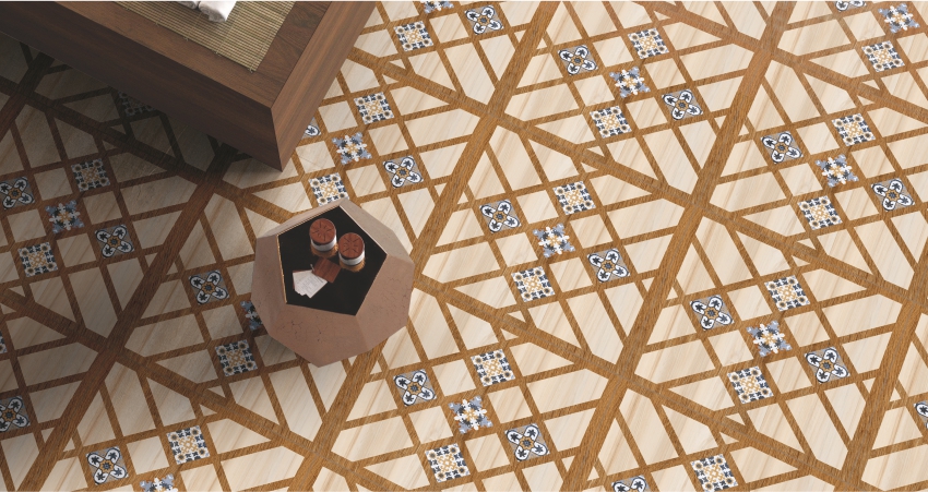 Geometric patterned tile flooring with wood accents and small blue floral details