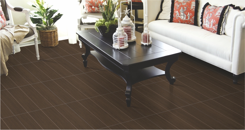 Living room with dark wood floor tiles, a black coffee table, and white seating
