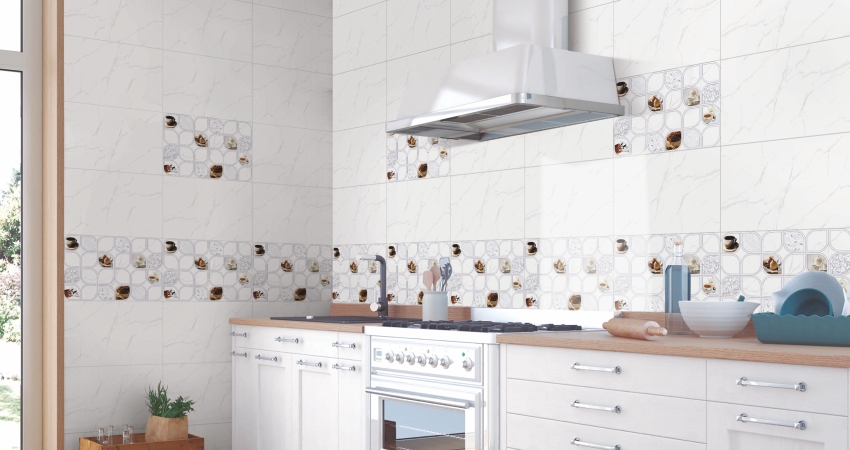 Stylish kitchen with white cabinets and flower-patterned tiles on the wall