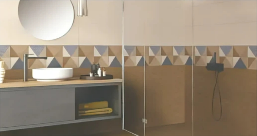Innovative bathroom with geometric cement tile accent and floating vanity with vessel sink.