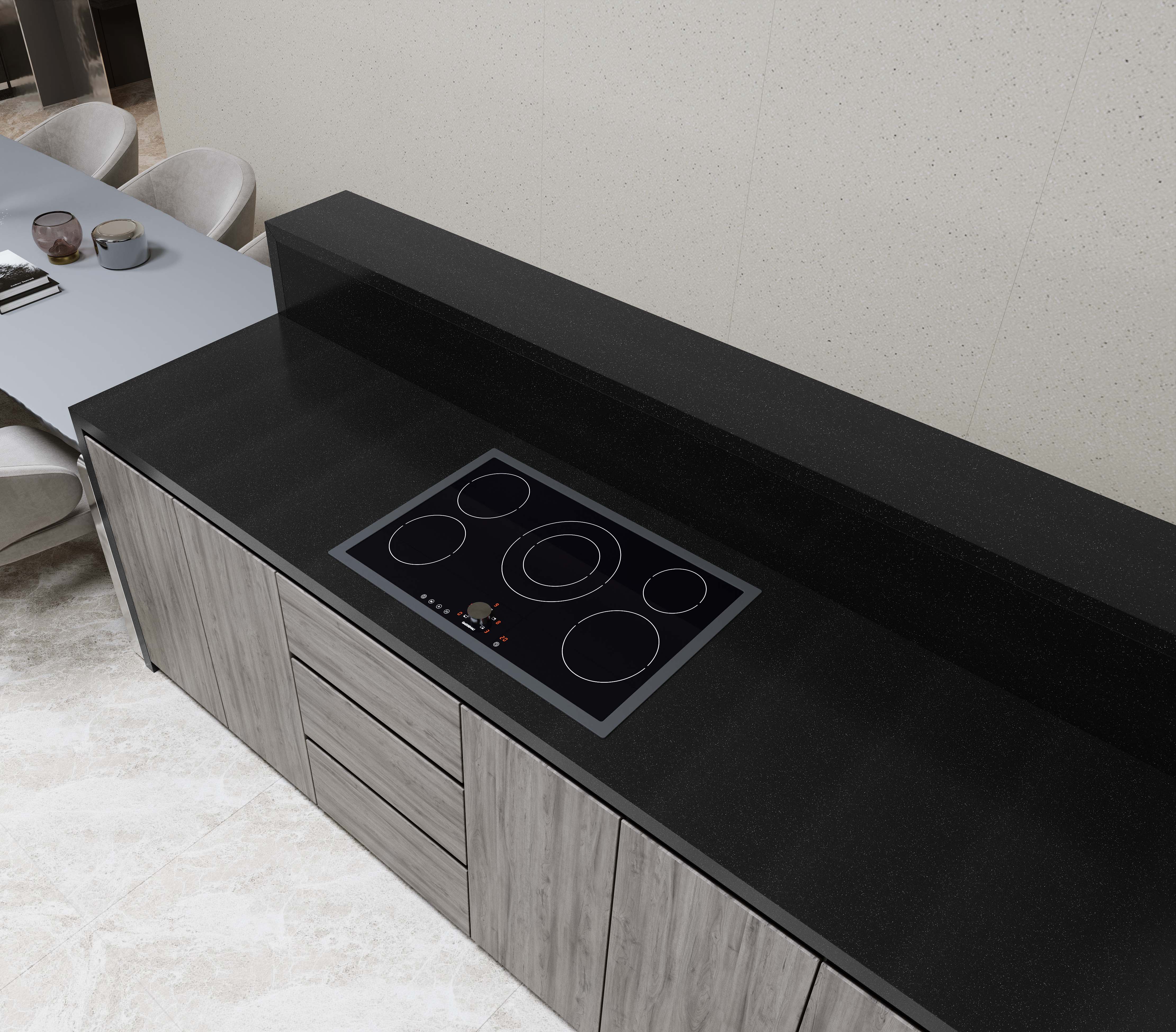 A modern kitchen counter with a black induction cooktop and gray wood cabinets beneath