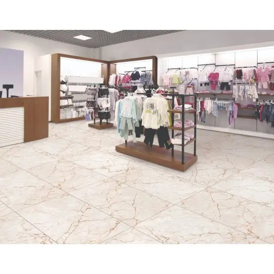 A retail store with marble-style tiles, organized clothing racks, and bright lighting